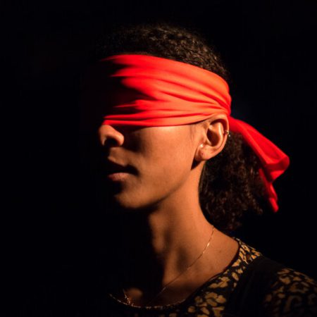 A person blindfolded in Tapestries by BitterSuite